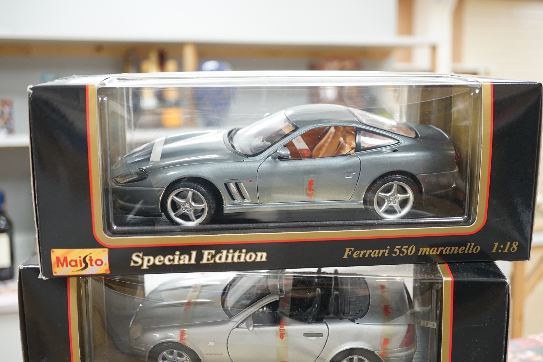 Five boxed 1:18 model cars by Maisto and Bburago; Jaguar S-Type, Jaguar XKR, Ferrari 550 maranello, Mercedes-Benz SLK 230 and a BWM M roadster